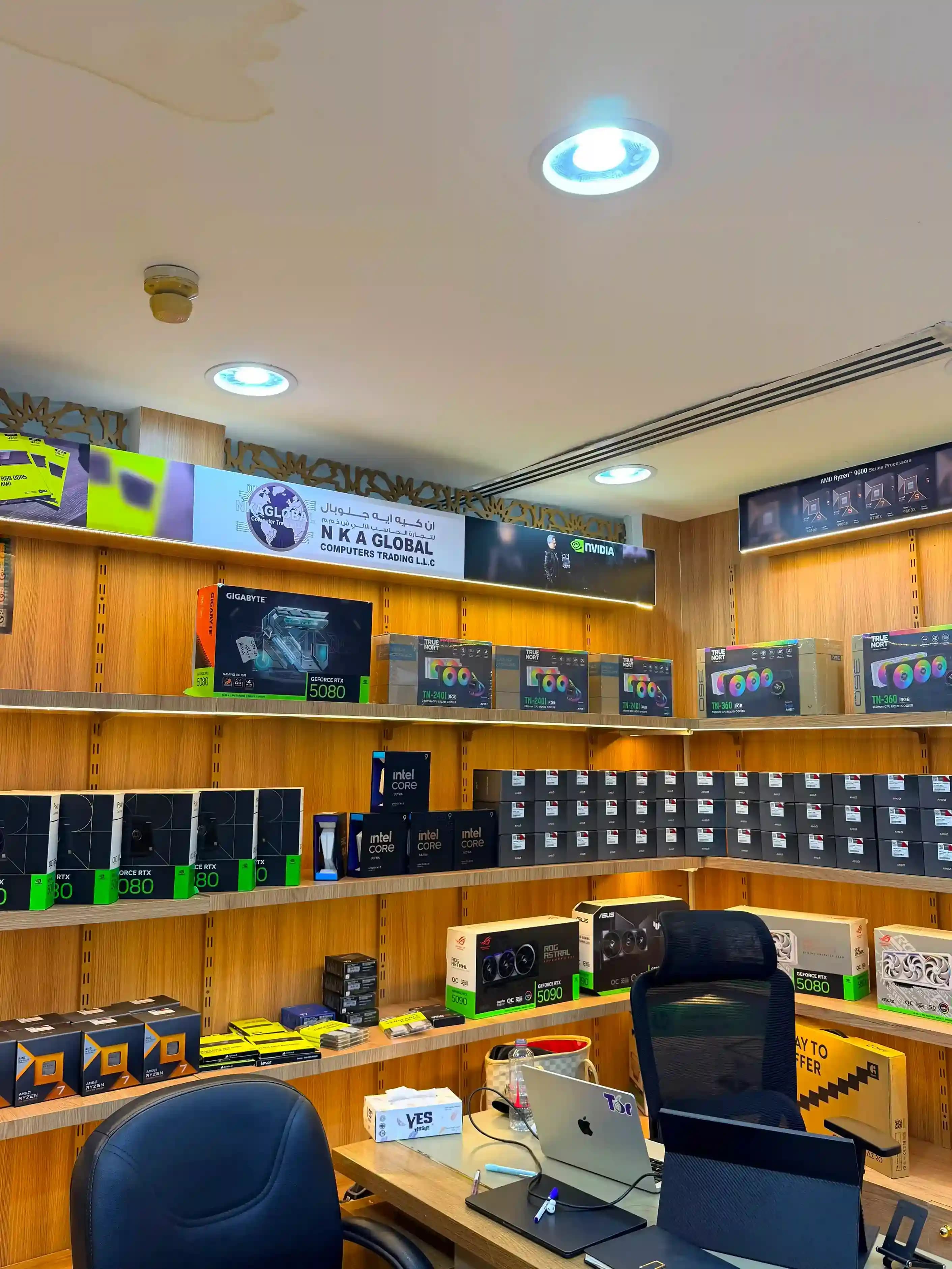 Inside GCC Gaming PC: shelves stocked with RTX graphics cards, Intel and AMD processors and RGB cooling