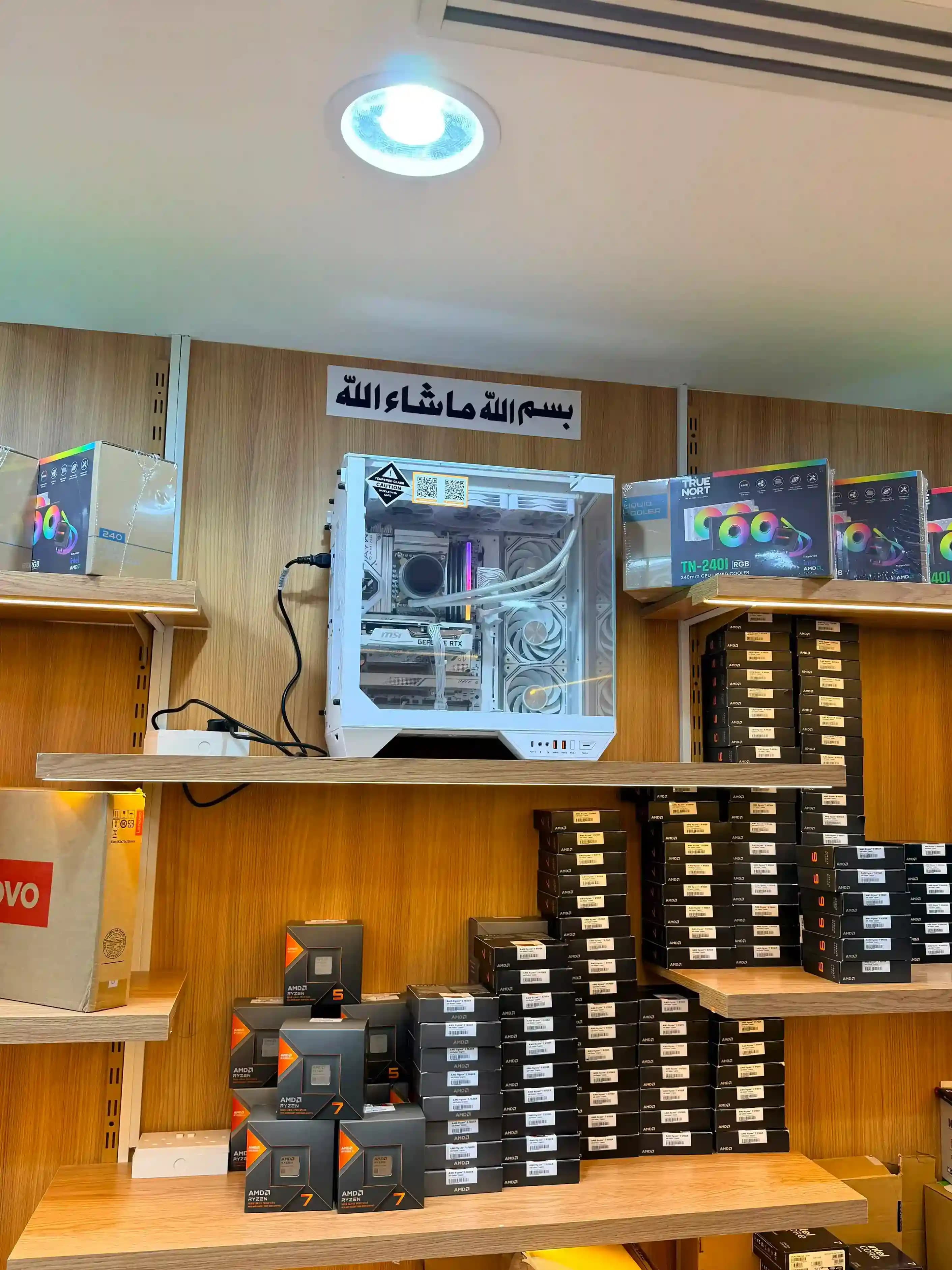 Custom white gaming PC build on display next to AMD Ryzen processors at GCC Gaming PC, Bur Dubai